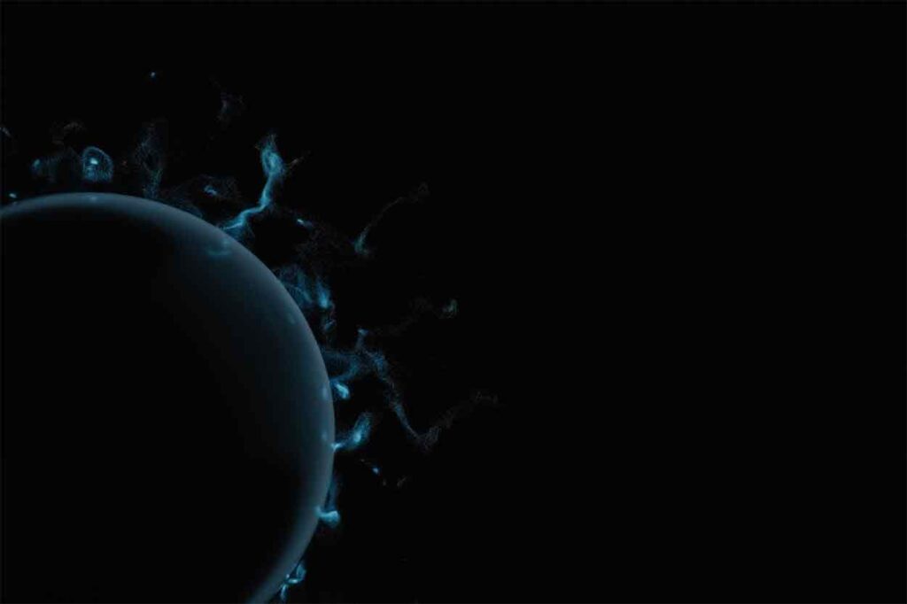 A sphere in darkness emitting tiny blue whisps.