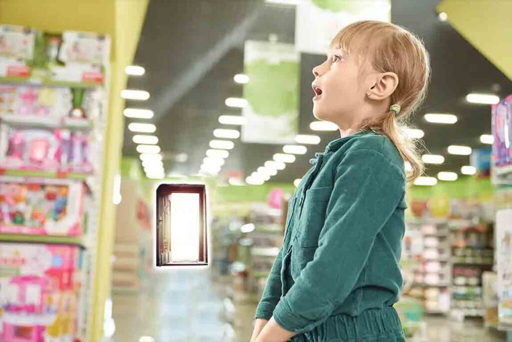 Small girl in a toy store. The toys are distracting her form the open door in the bakc of the store.