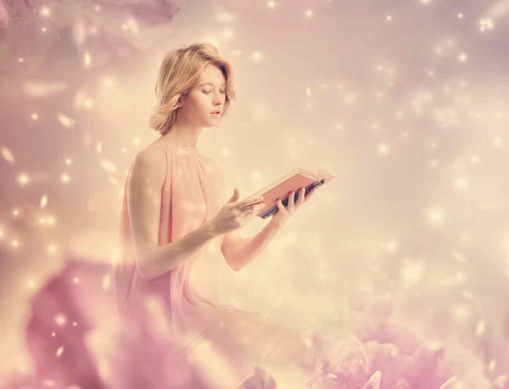 Woman reading a book in a fairy tale setting.